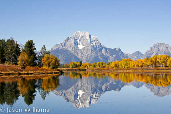 Mount Moran With Fall Foliage Reflects Off The Owbow Bend Of The Snake River In Grand Teton National Park